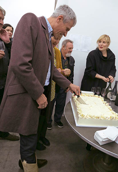 Jonathan cutting the cake